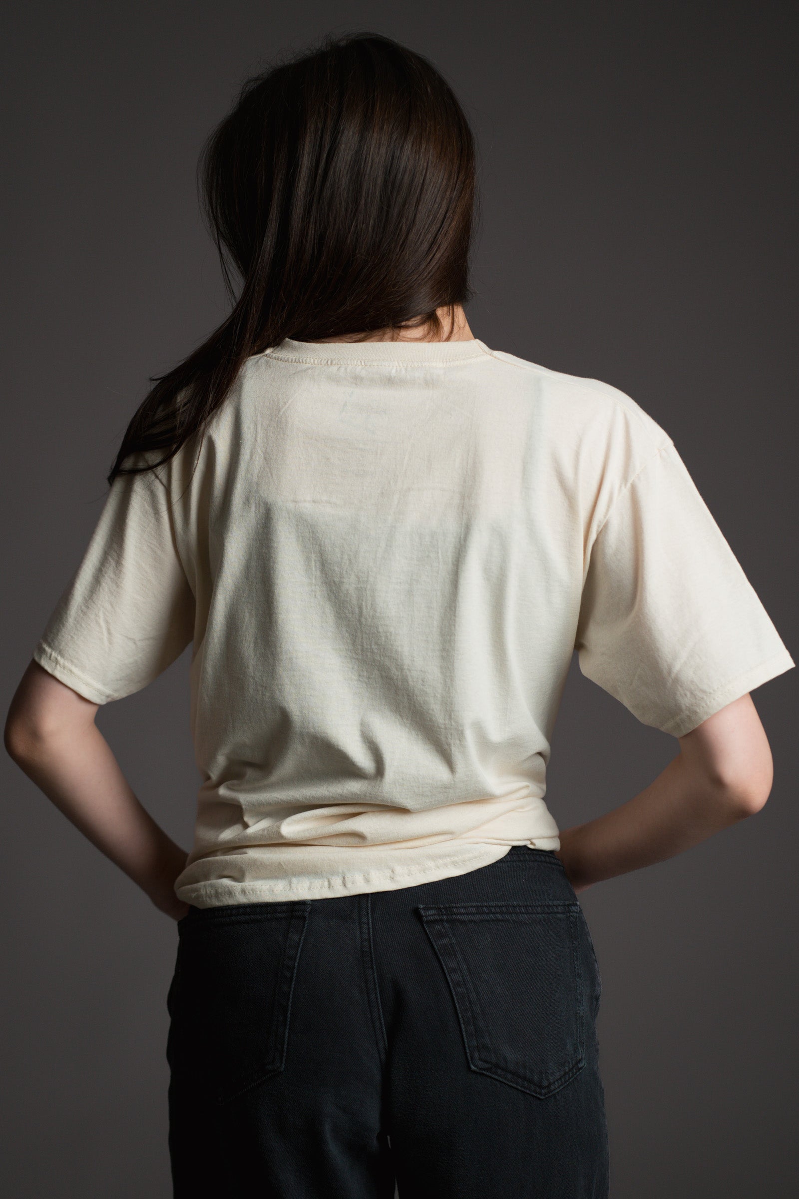 Plain back view of Little Lies cream Rolling Stones MTV logo band tee.