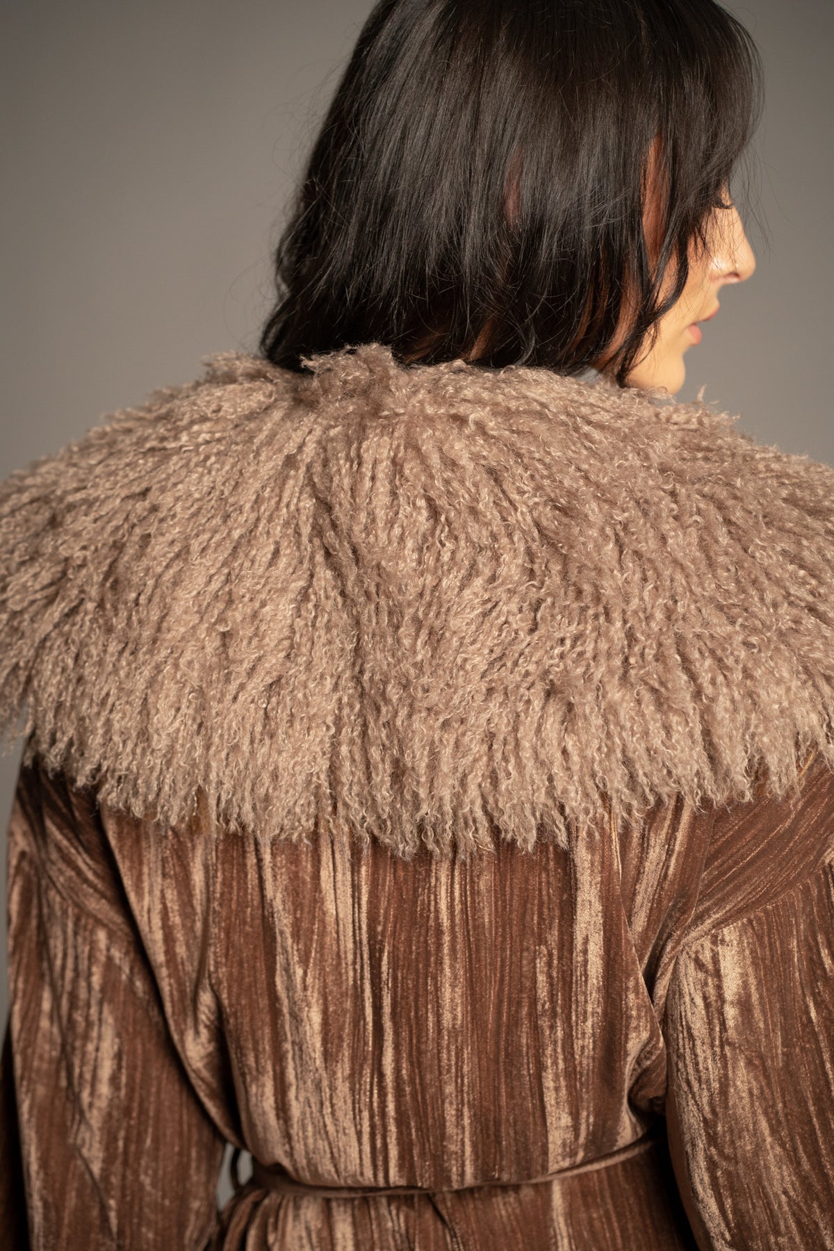 Close-up back view of Sienna velvet kimono jacket showcasing oversized faux fur collar and textured bronze velvet fabric