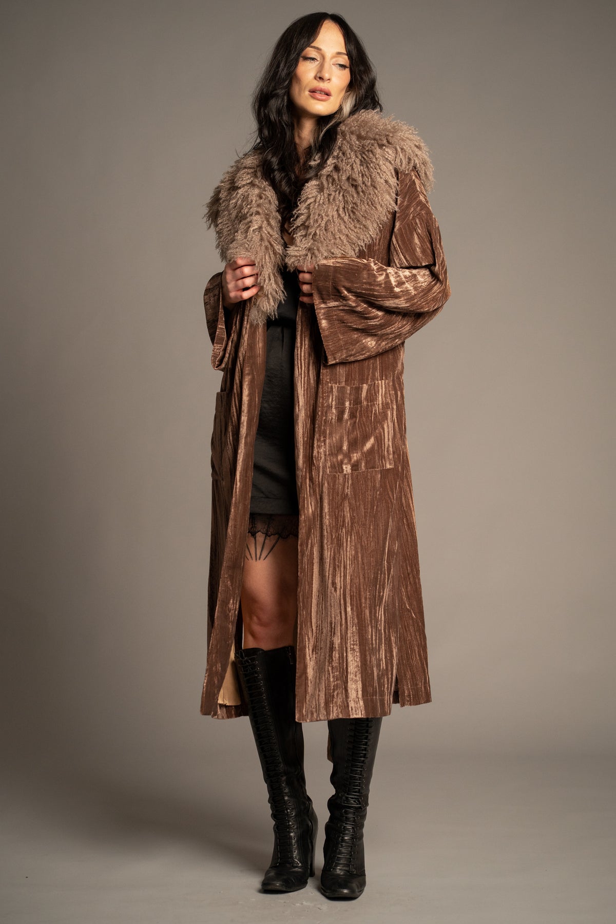 Sienna velvet kimono jacket styled over a black lace-trim mini dress with knee-high boots, featuring a dramatic faux fur collar