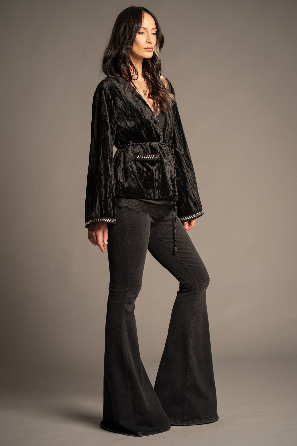Silver Springs black studded velvet jacket worn closed with beaded rope tie belt,  silver stud trim front pockets and cuffs, relaxed fit