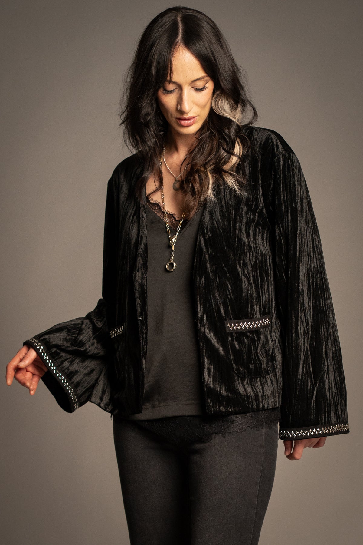 Silver Springs black velvet jacket worn open featuring silver stud detailing, front pockets and a draped silhouette