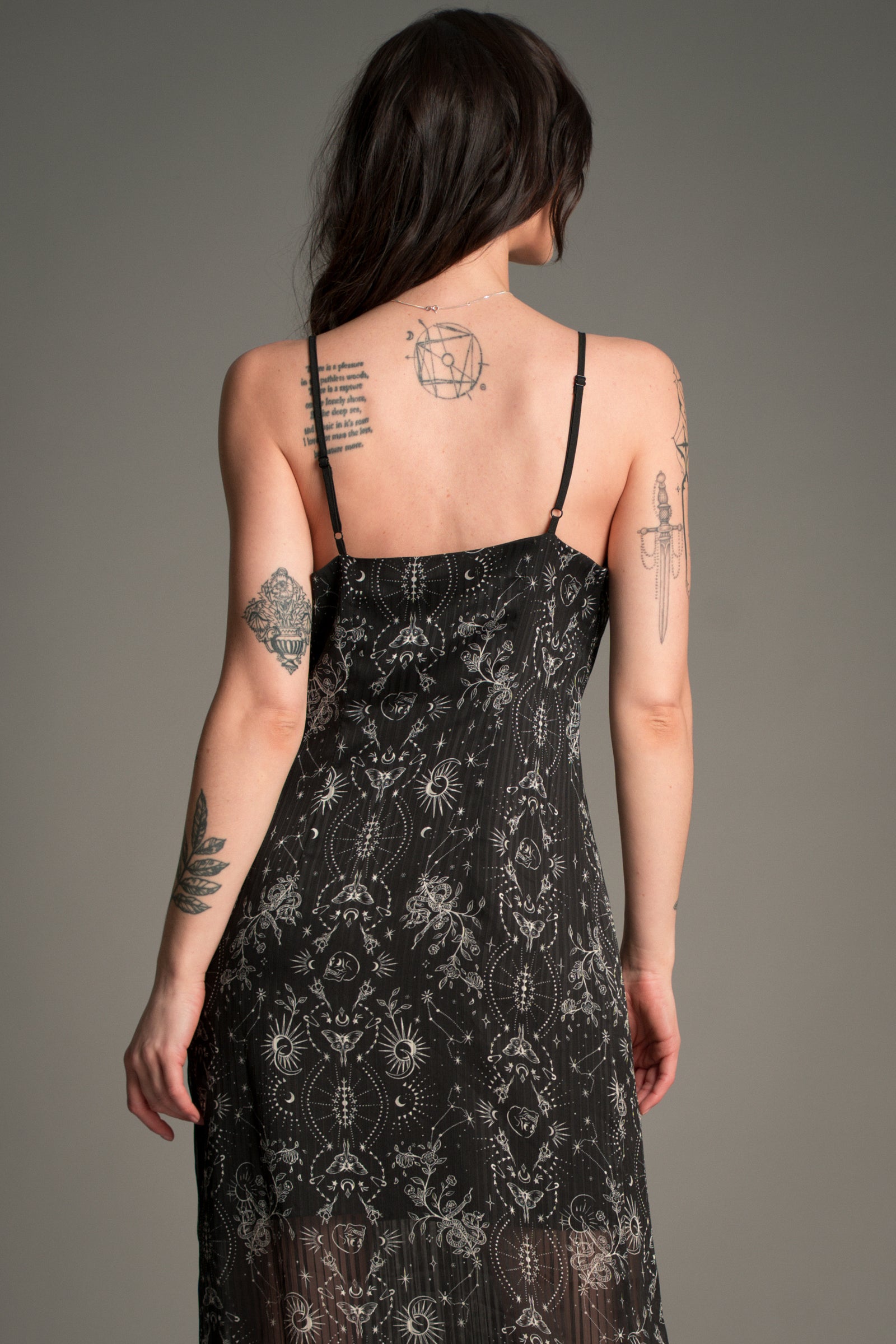 Back view of the Little Lies Tattoo Slip Dress in black patterned lace with adjustable straps and sheer detailing.