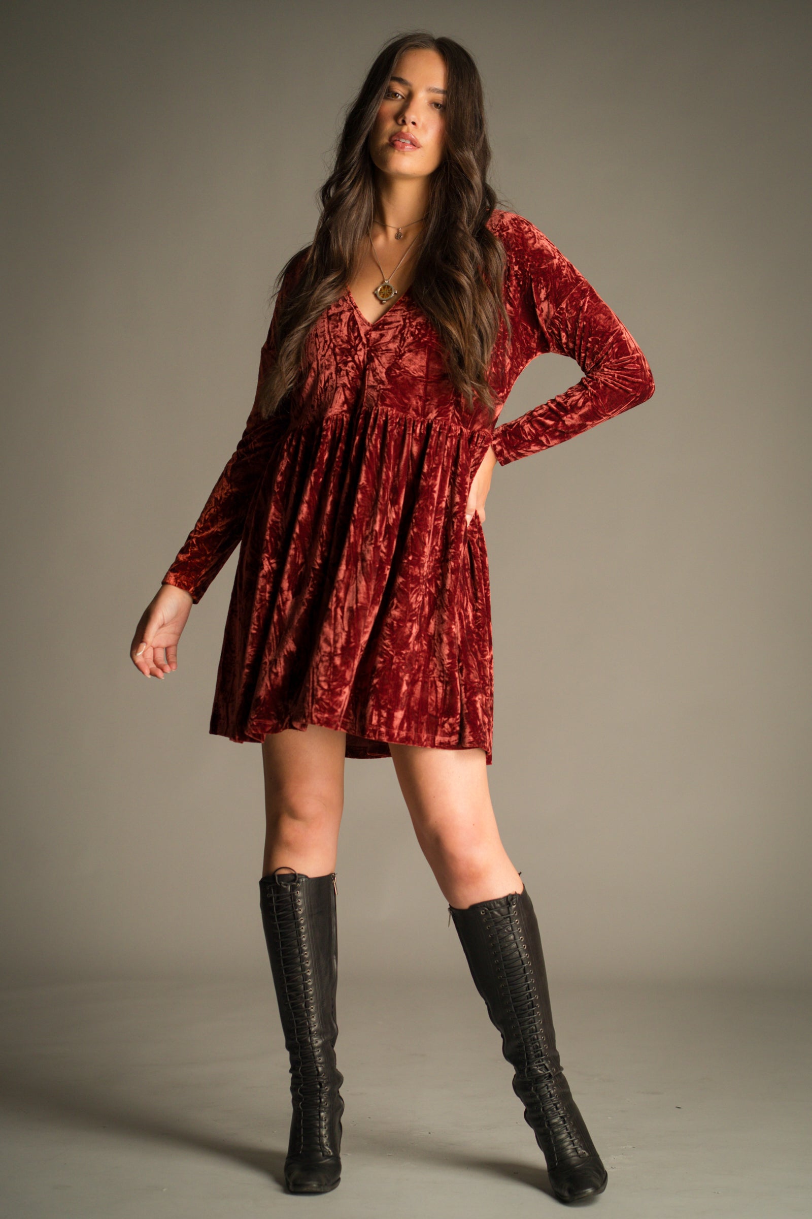 Front view of the Velvet Goldmine Rust Smock Dress in rich copper-rust crushed velvet. Styled with vintage YSL knee high boots.