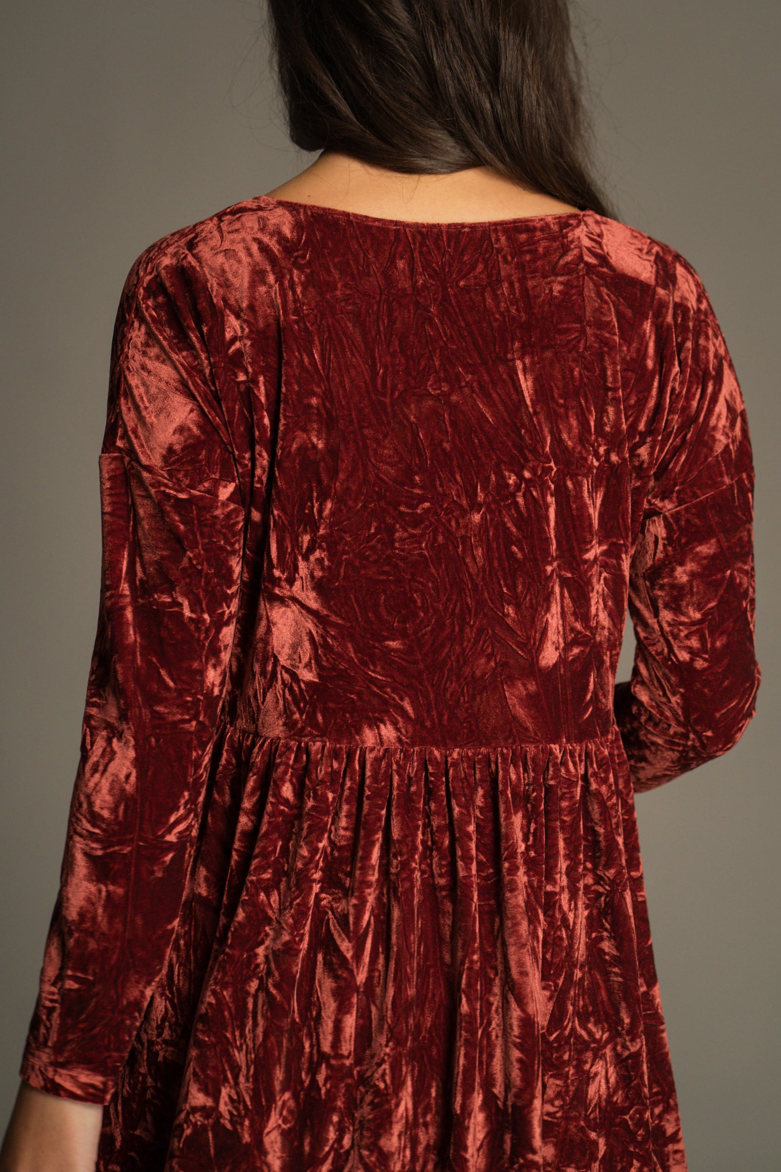 Back view of the Velvet Goldmine Rust Smock Dress showing  neckline and crushed velvet texture.