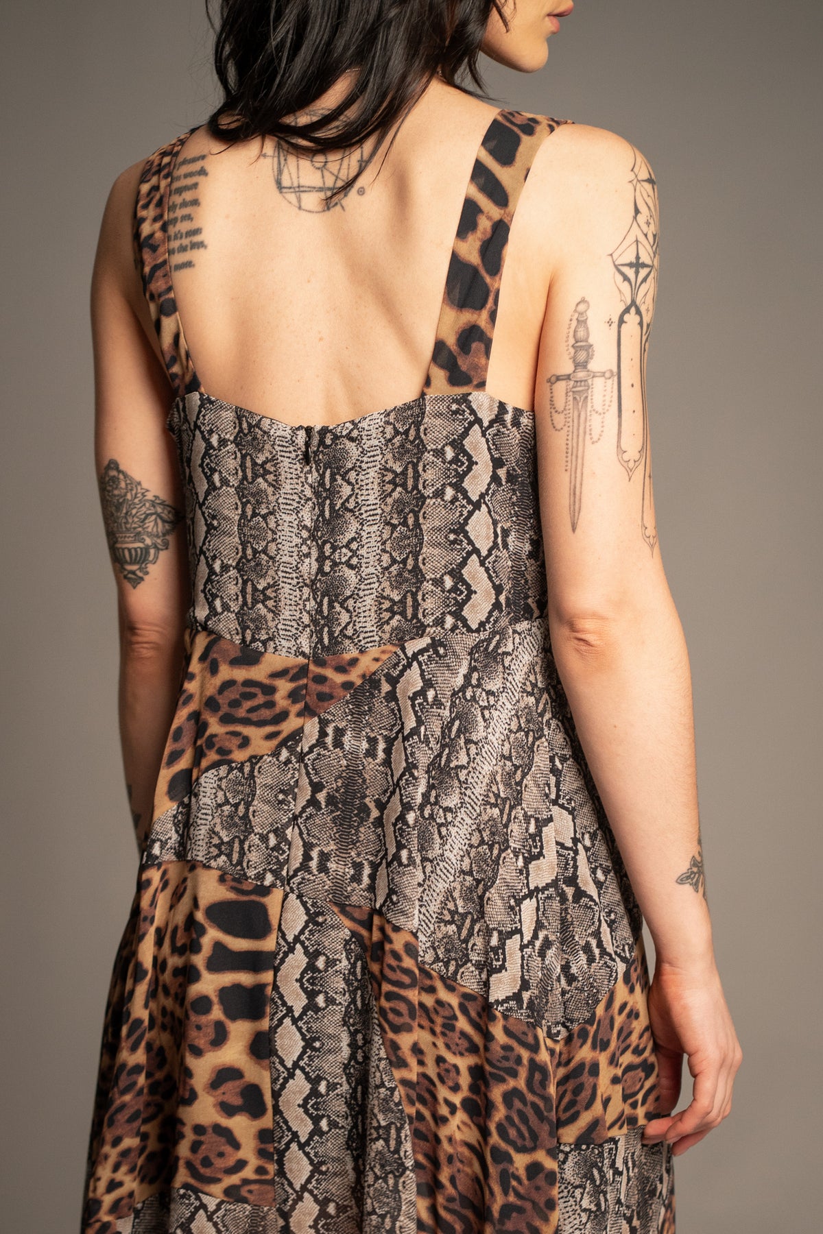 Little Lies Zadie Animal Handkerchief Dress back view featuring contrast leopard and snakeskin print panels with sleeveless design