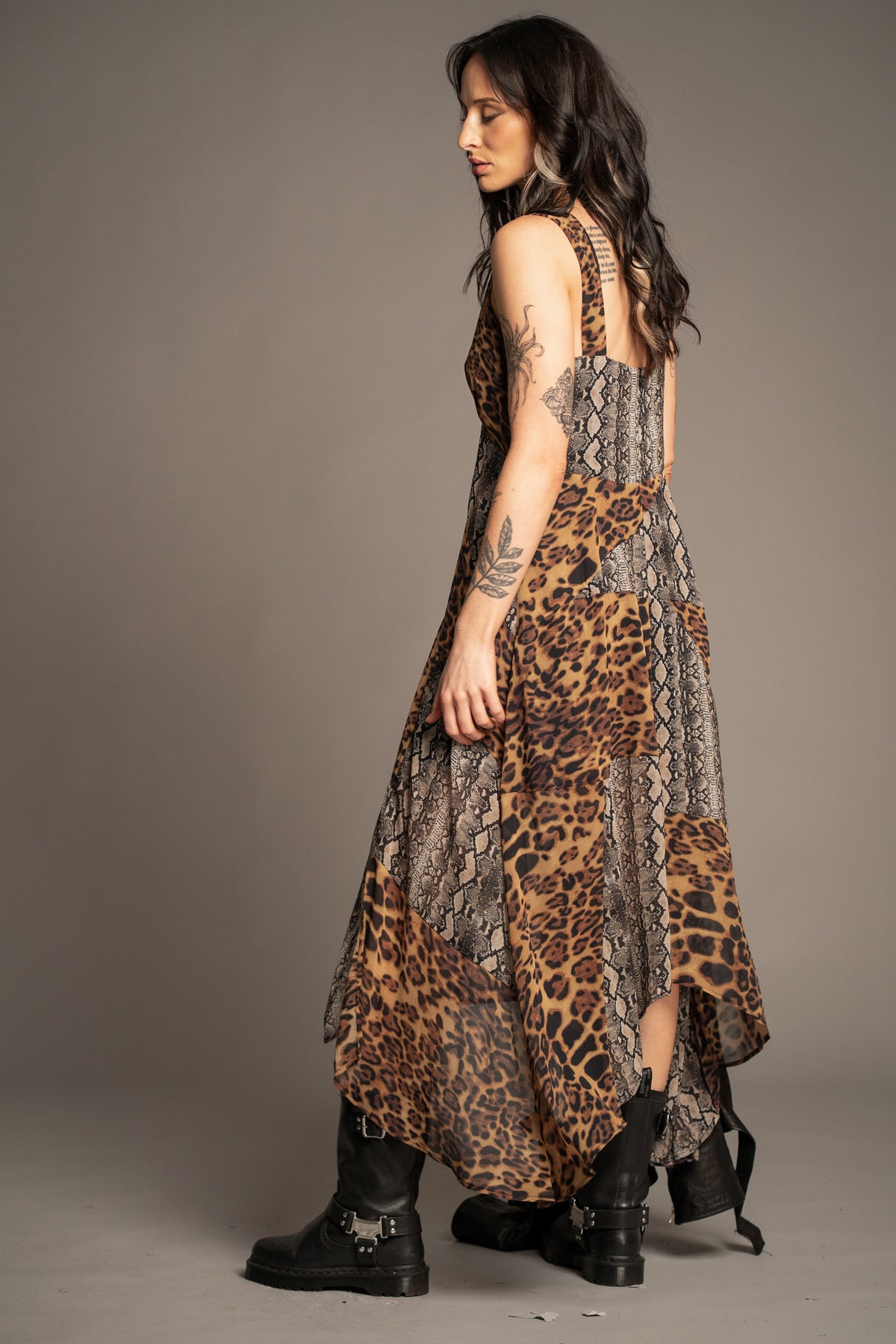 Little Lies Zadie Animal Handkerchief Dress side view showcasing mixed animal print design, flowing silhouette and handkerchief hem detail