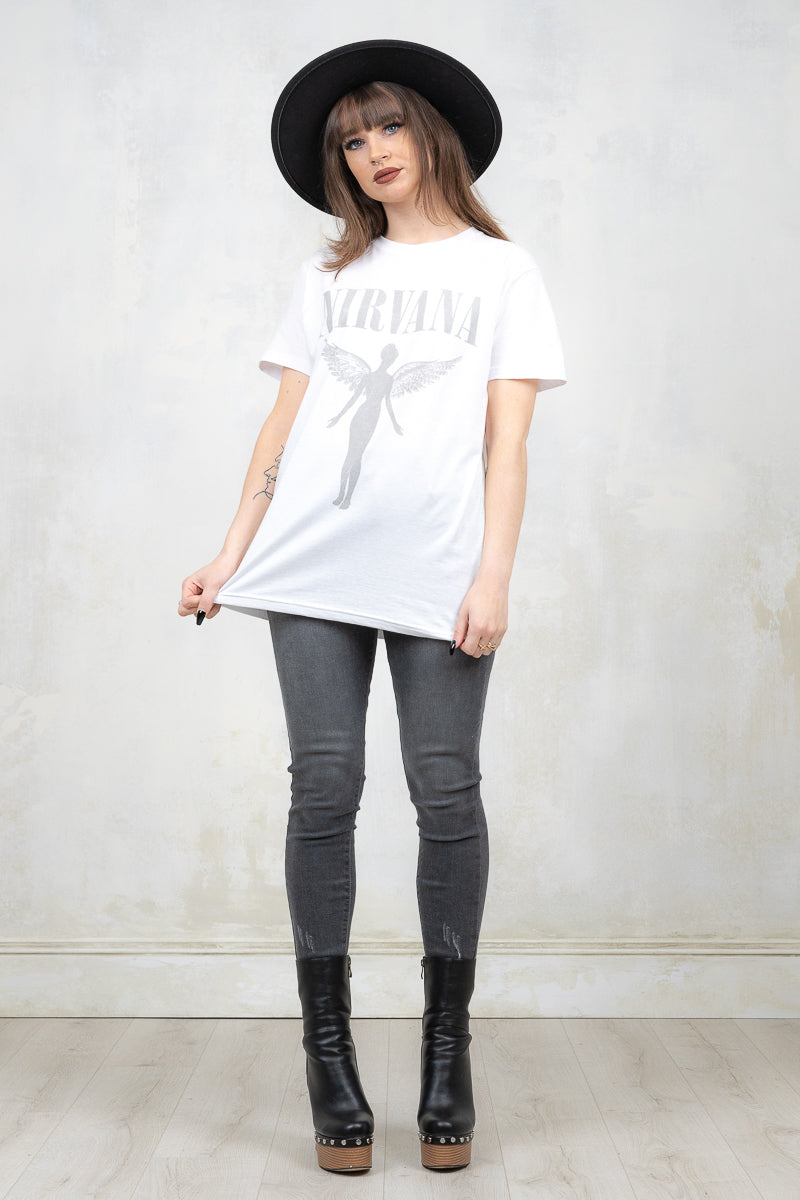 Model wearing Nirvana White Angelic Tee - white nirvana band tee with grey angel and logo