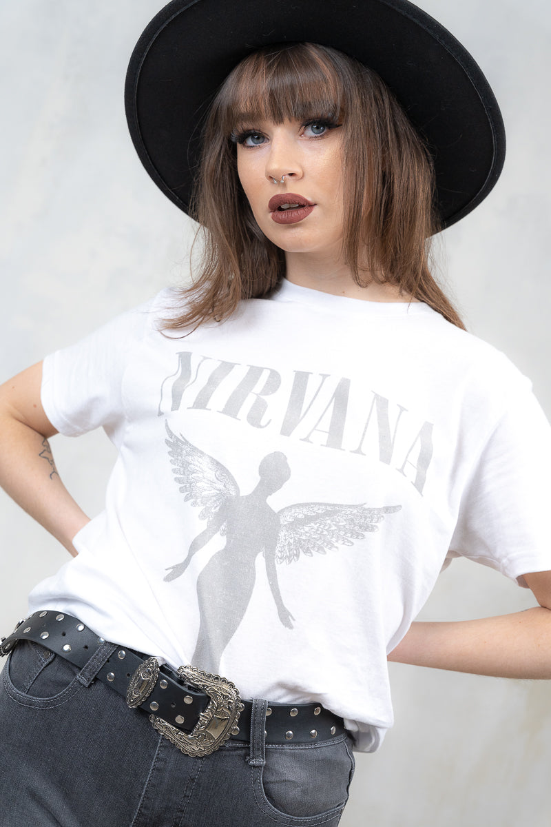 Model wearing Nirvana White Angelic Tee - white nirvana band tee with grey angel and logo