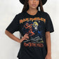 Model wearing Iron Maiden Run to the Hills Tee- Black Iron Maiden band tee with red and yellow band logo