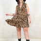 Model wearing Landslide Leopard Smock - leopard print, sleeveless smock dress with a tiered a-line skirt and plunge neckline