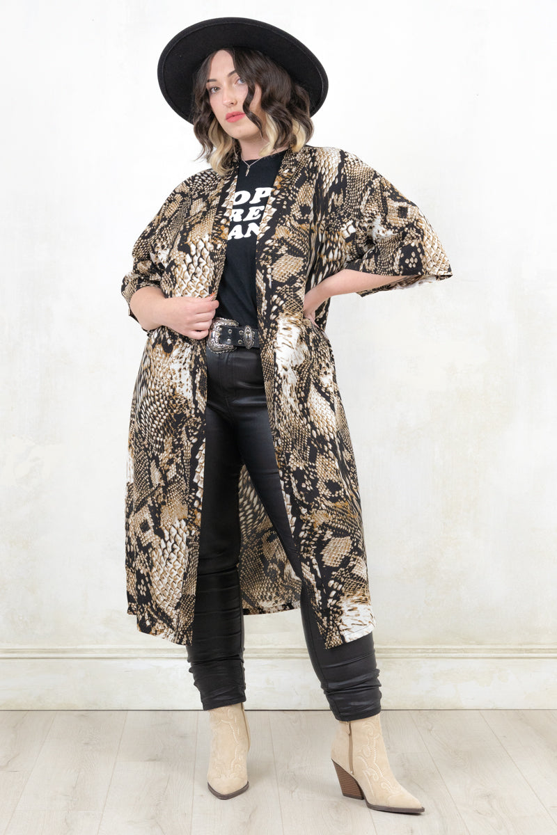 Model wearing Runaway Snake Kimono, an open front snake print kimono with side splits
