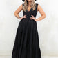 Model wearing Strange Magic Maxi Dress, a Black Sleeveless smock shape dress with side zip closure and tiered hem