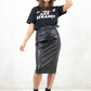 Model wearing Atomic Biker Midi Skirt, a Black pencil-fit faux leather Midi Skirt with an asymmetric zip feature and biker waist belt