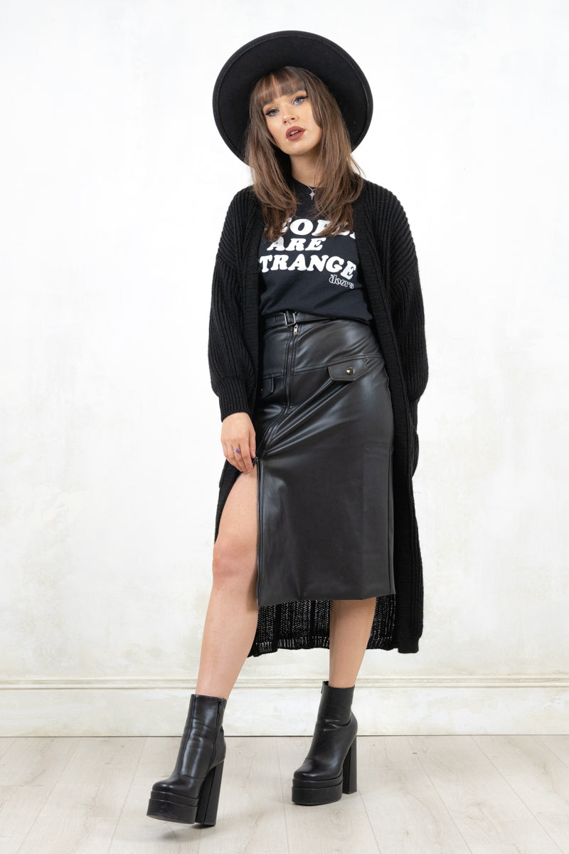 Model wearing Atomic Biker Midi Skirt, a Black pencil-fit faux leather Midi Skirt with an asymmetric zip feature and biker waist belt