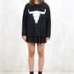 Model wearing Bison Monochrome Heavy Knit, a black relaxed fit jumper with hand drawn bison graphic