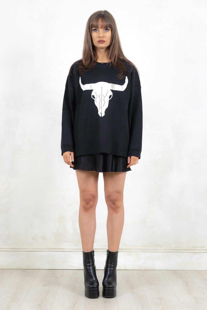 Model wearing Bison Monochrome Heavy Knit, a black relaxed fit jumper with hand drawn bison graphic