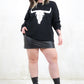 Model wearing Bison Monochrome Heavy Knit, a  black relaxed fit jumper with hand drawn bison graphic