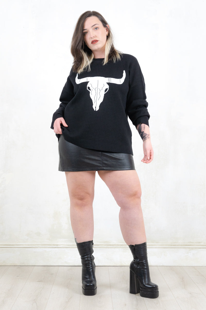 Model wearing Bison Monochrome Heavy Knit, a  black relaxed fit jumper with hand drawn bison graphic