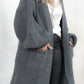 Model wearing All Apologies Charcoal Cardigan - Charcoal oversized knit cardigan , Open front with true pockets