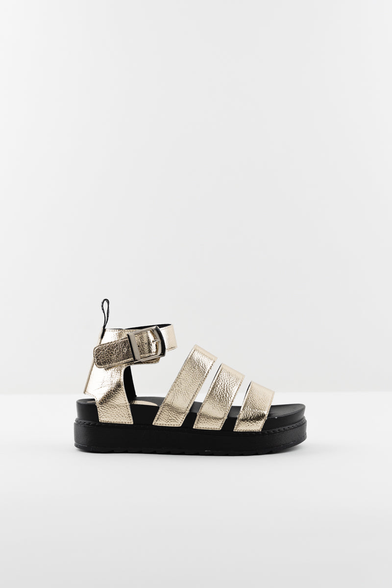 Este Gold Sandals - Multi strap flatform sandal. With a chunky sole, textured faux leather and metallic gold finish
