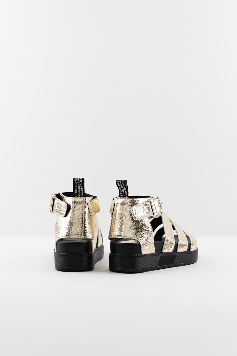 Este Gold Sandals - Multi strap flatform sandal. With a chunky sole, textured faux leather and metallic gold finish
