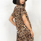 Model wearing Saint and Sinner Leopard T-Shirt Dress, a leopard print t-shirt dress with Concealed back zip closure