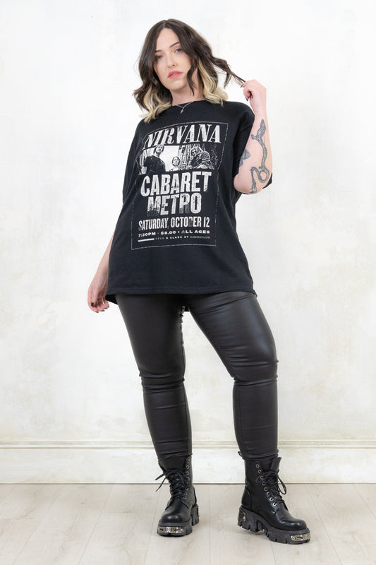 Model wearing Nirvana Cabaret Metro Tee - Black Nirvana Band Tee with Concert Poster Design and band group shot