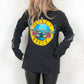 Model wearing Guns N Roses Hollywood Tour Tee - Charcoal Long Sleeve Band Tee with Yellow and Blue Guns N Roses Logo on front and tour dates on back