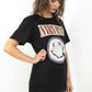 Model wearing Nirvana Tee - Black Nirvana Band Tee with Red, Blue and White Band Smiley Logo
