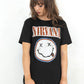 Model wearing Nirvana Tee - Black Nirvana Band Tee with Red, Blue and White Band Smiley Logo 