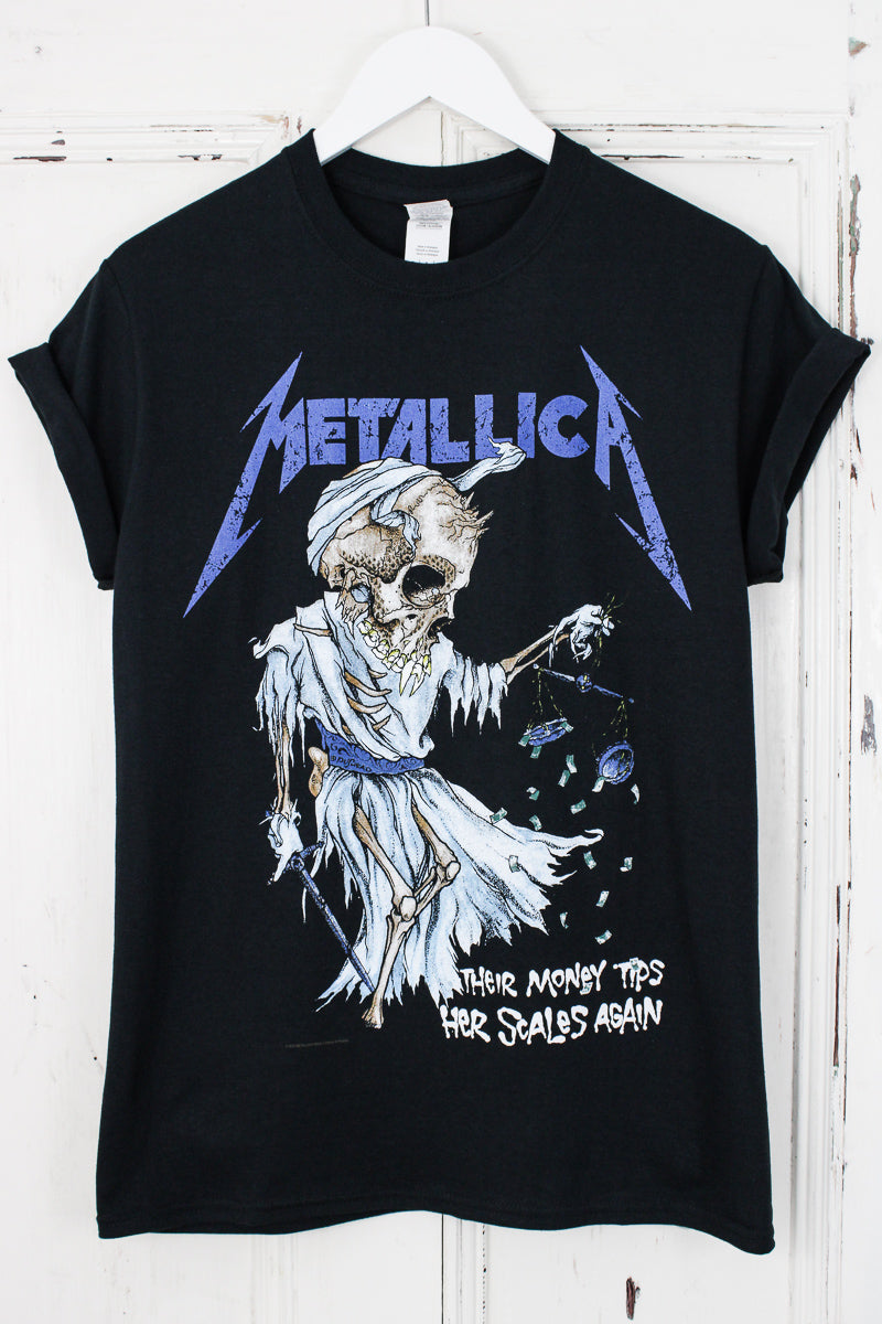 Metallica Doris Tee - Black Metallica Tee with blue Metallica Logo, skull design and white "Their Money Tips Her Scales Again" Slogan on front