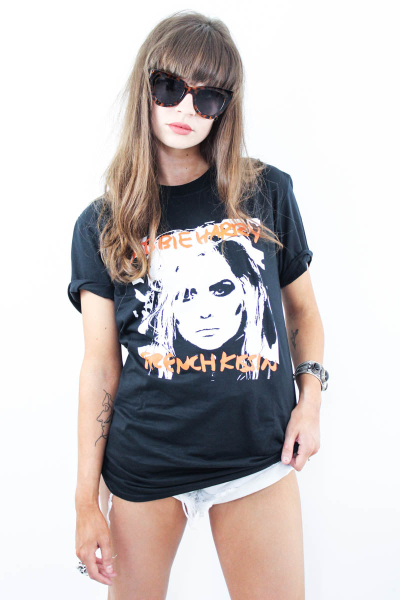 Model wearing Debbie Harry French Kissin' Tee - Black tee with Debbie Harrie Portrait and red "Debbie Harry French Kissin" Slogan