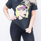 Model wearing Blondie Tee - Black Blondie Tee with pink Blondie logo and Debbie Harry design
