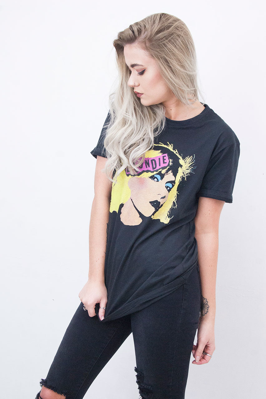 Model wearing Blondie Tee - Black Blondie Tee with pink Blondie logo and Debbie Harry design